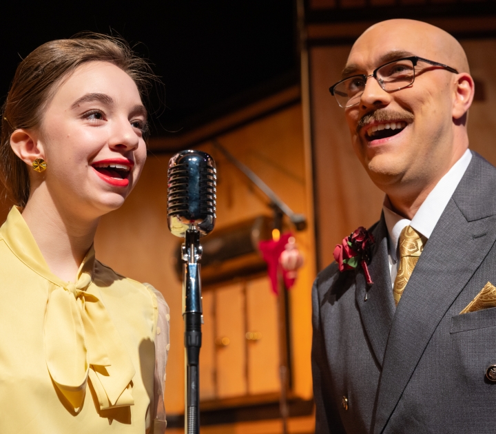 Two student actors in It's a Wonderful Life: A Live Radio Play