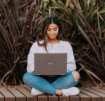 Student with a laptop outside