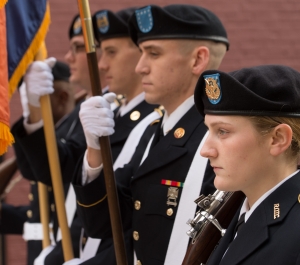 Student veterans hold flags