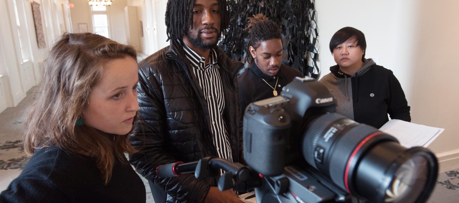 Media production students with a camera