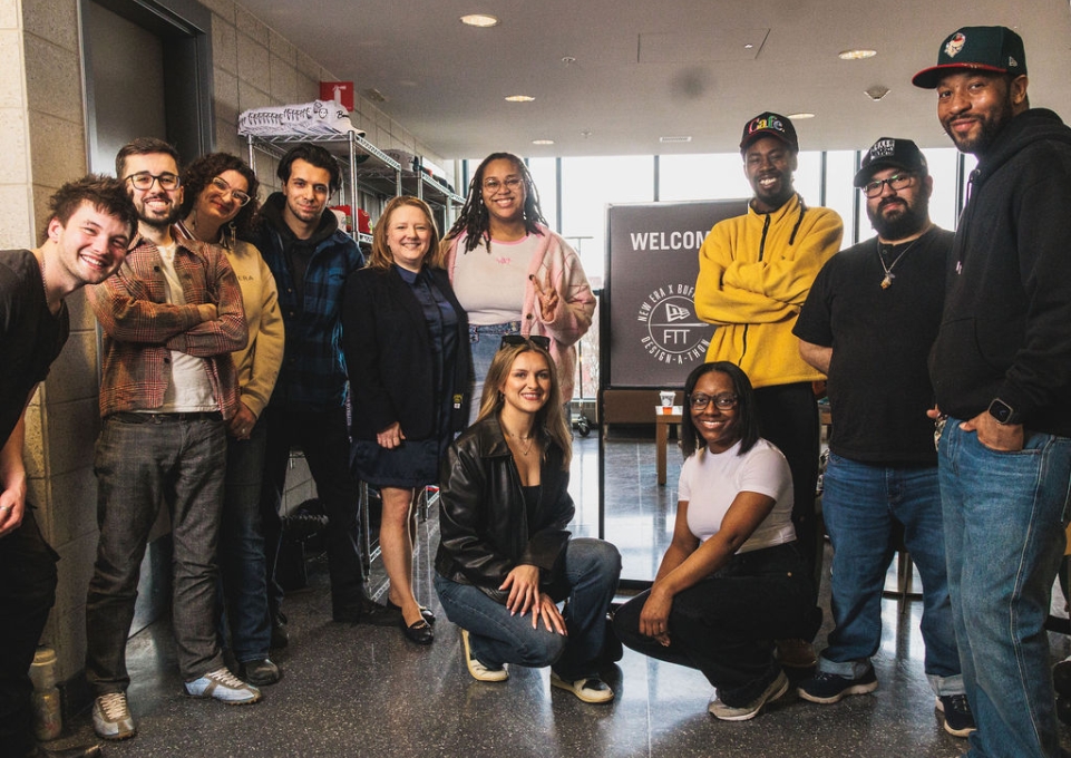 A group of students standing in front of a sign that reads Welcome to New Era Buffalo State Design a Thon